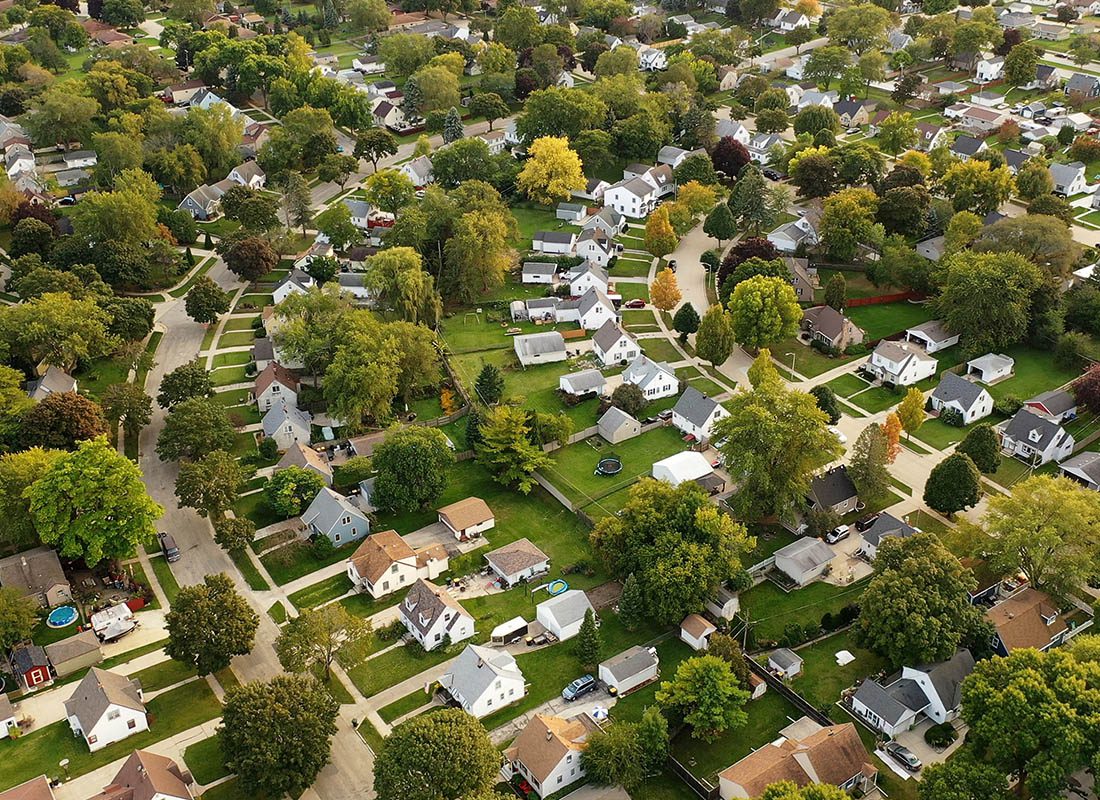Wayzata, MN - Aerial View of Residential Homes and Trees During the Day